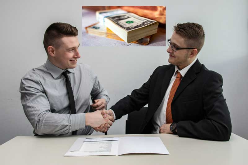 men having an handshake in farm loan